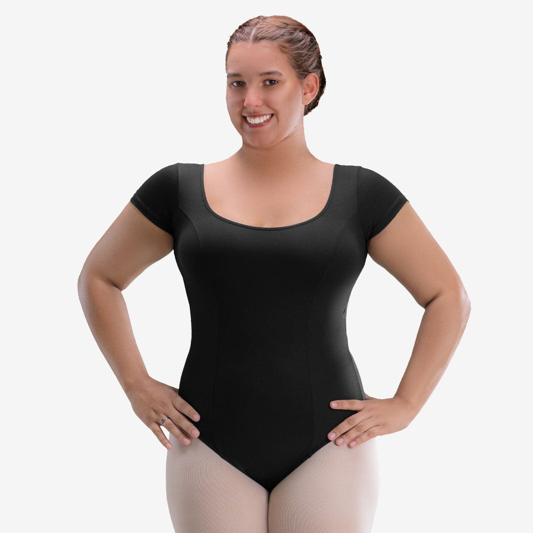 Woman wearing a black leotard on a white background
