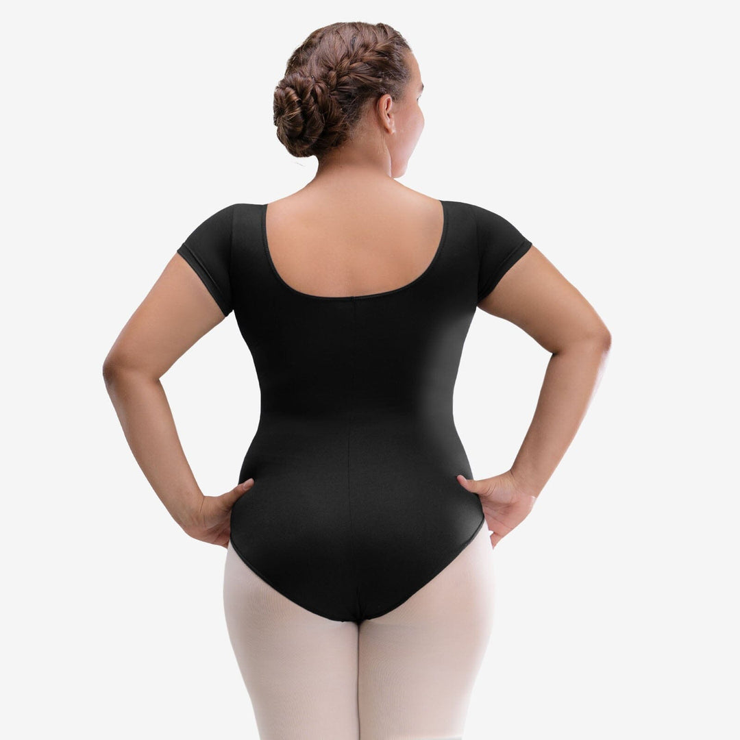 Person wearing a black bodysuit on a white background