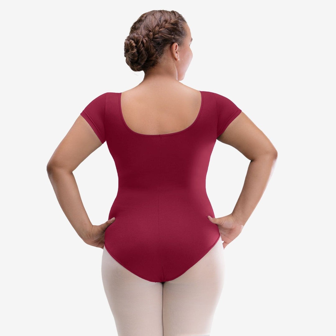 Person wearing a maroon bodysuit on a white background