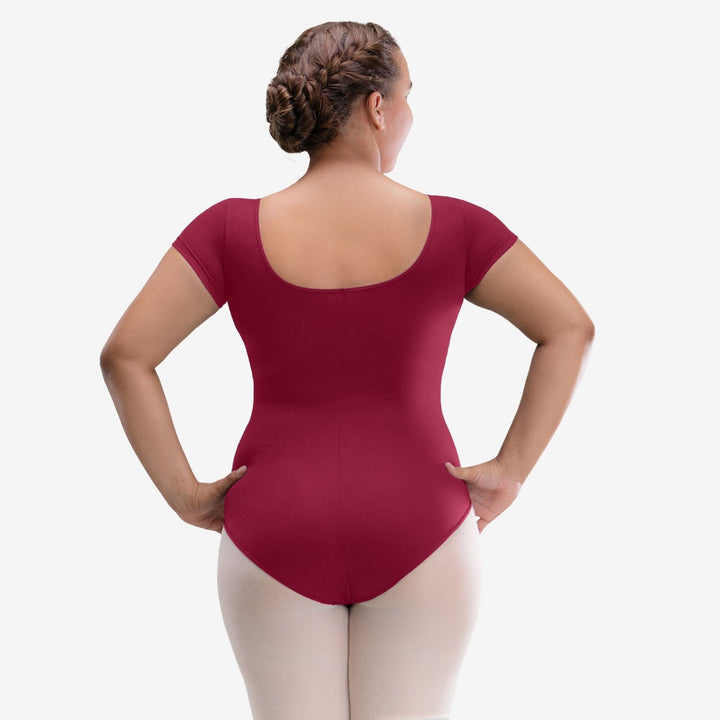 Person wearing a maroon bodysuit on a white background