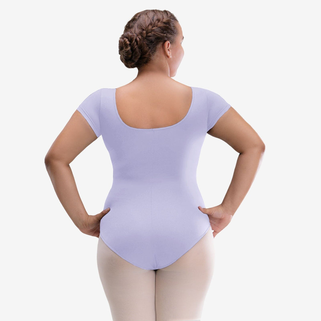 Person wearing a light purple leotard on a white background