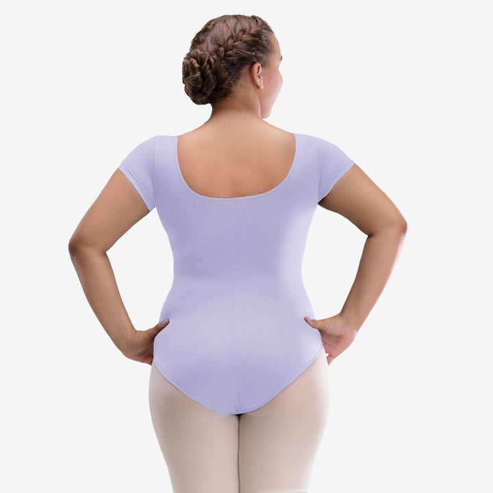 Person wearing a light purple leotard on a white background