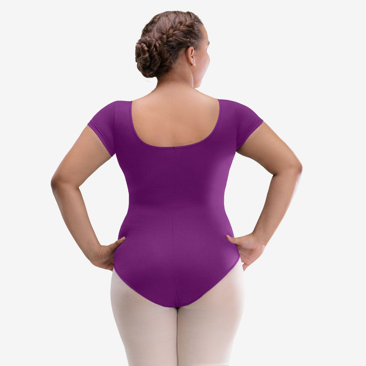 Person wearing a purple leotard on a white background