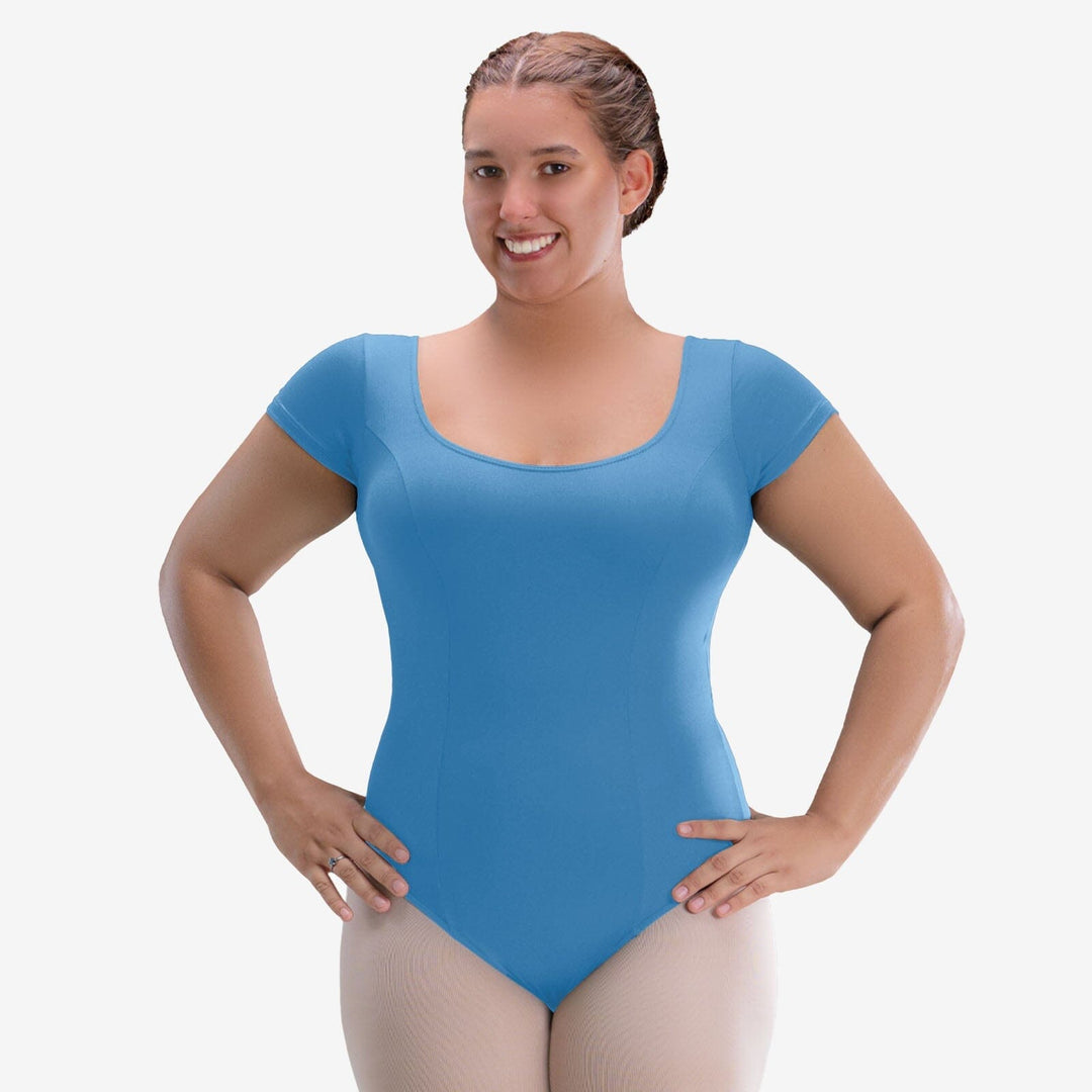 Woman wearing a blue leotard on a white background