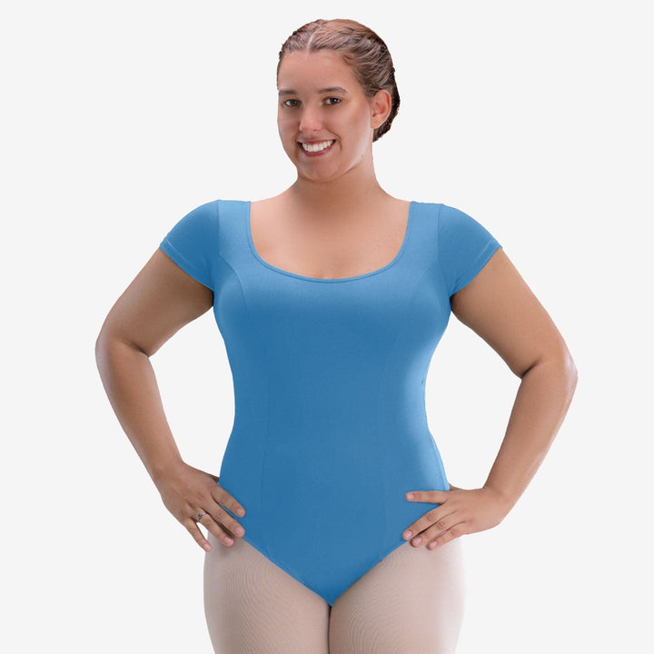 Woman wearing a blue leotard on a white background