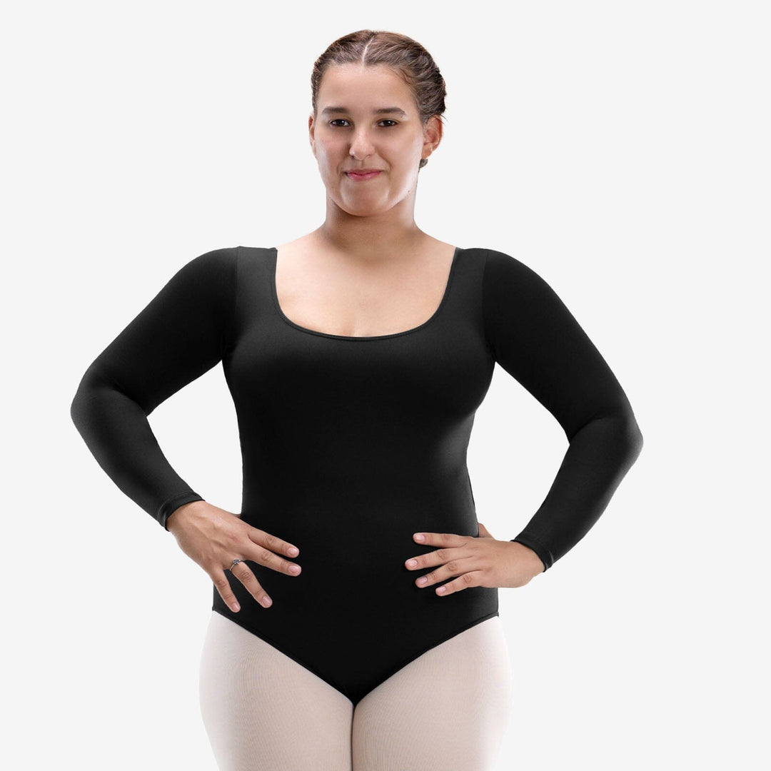 Woman wearing a black long-sleeve leotard on a white background