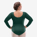 Person wearing a green leotard against a white background