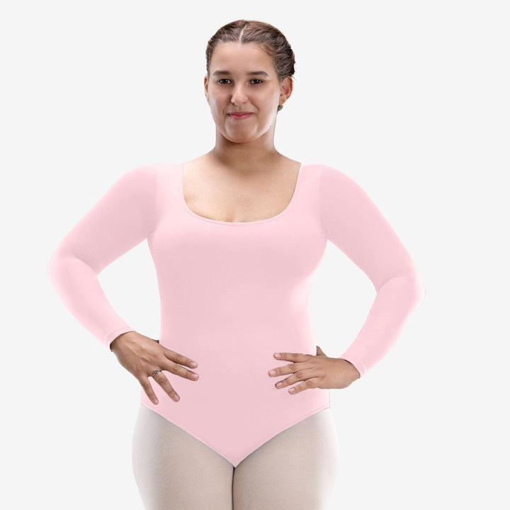 Person wearing a pink long-sleeve leotard on a white background