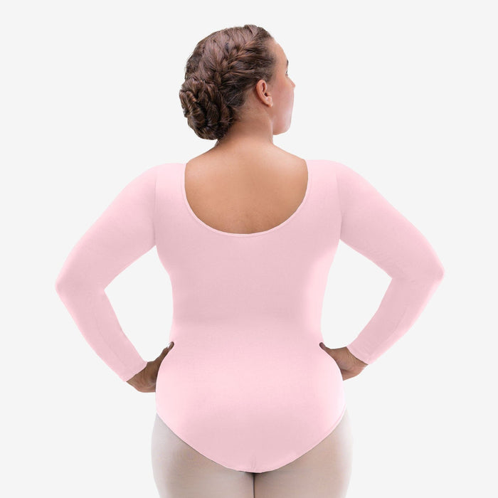 Person wearing a pink long-sleeve leotard on a white background