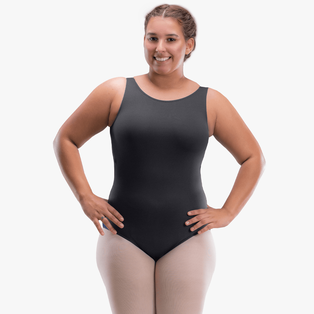 Woman wearing a black bodysuit on a white background
