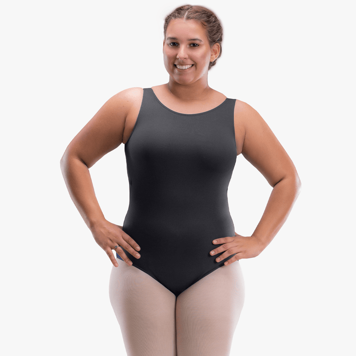 Woman wearing a black bodysuit on a white background