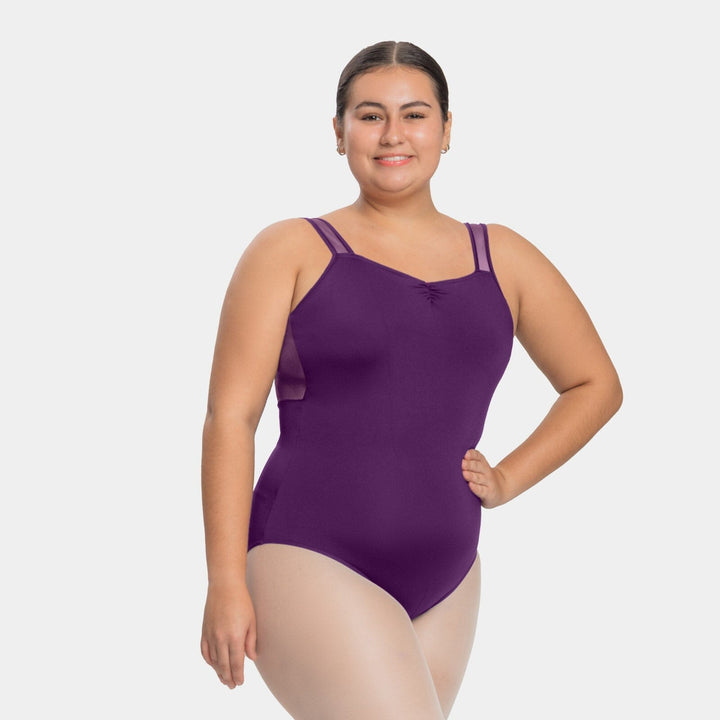 Woman wearing a purple swimsuit on a white background