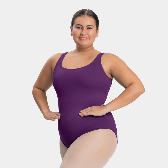Woman wearing a purple swimsuit on a white background