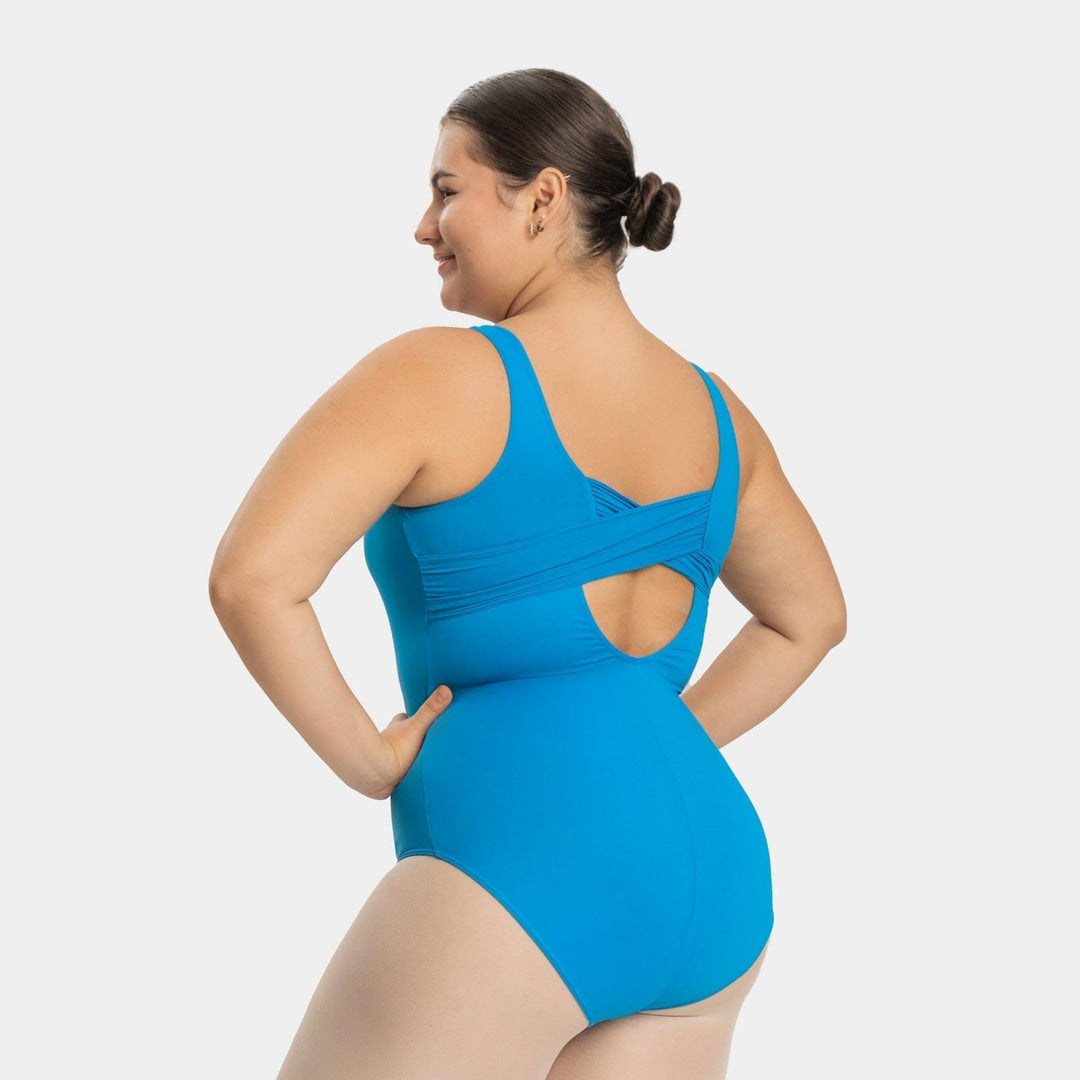 Woman wearing a blue one-piece swimsuit on a white background