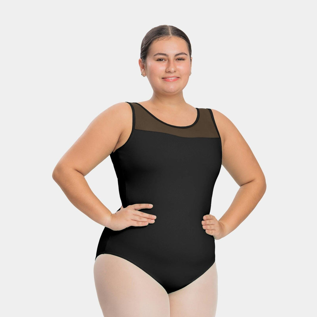 Woman wearing a black swimsuit with sheer mesh panels on a white background