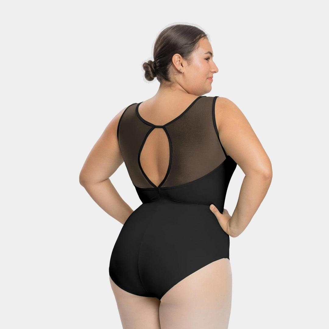 Woman wearing a black swimsuit with sheer mesh panels on a white background