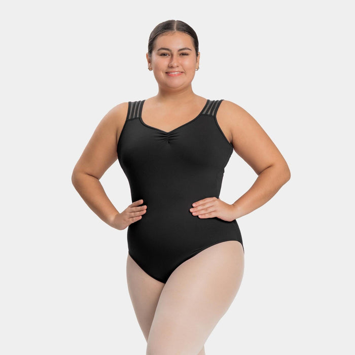 Woman wearing a black swimsuit with decorative straps on a white background