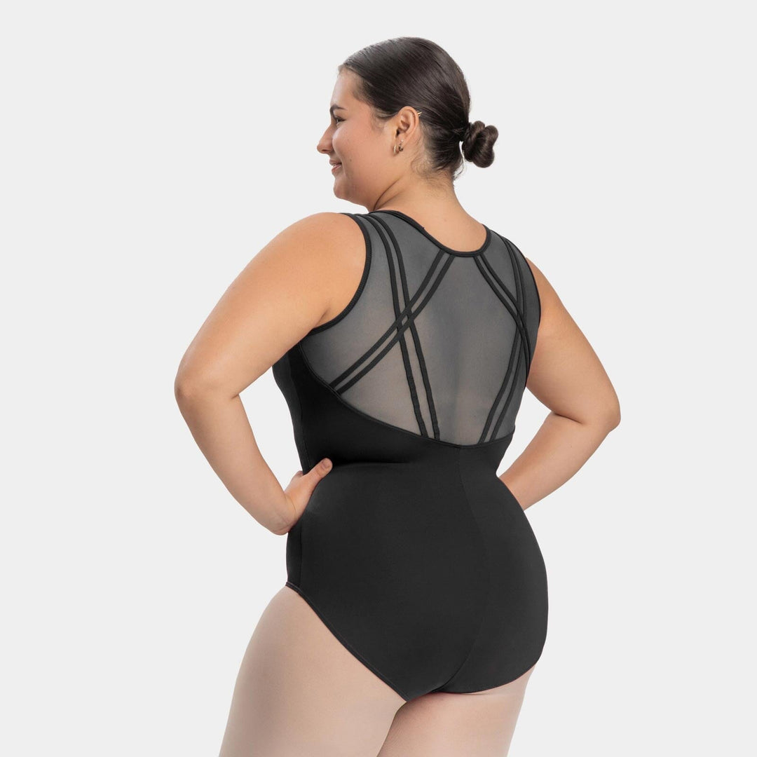 Woman wearing a black swimsuit with geometric cutouts on a white background