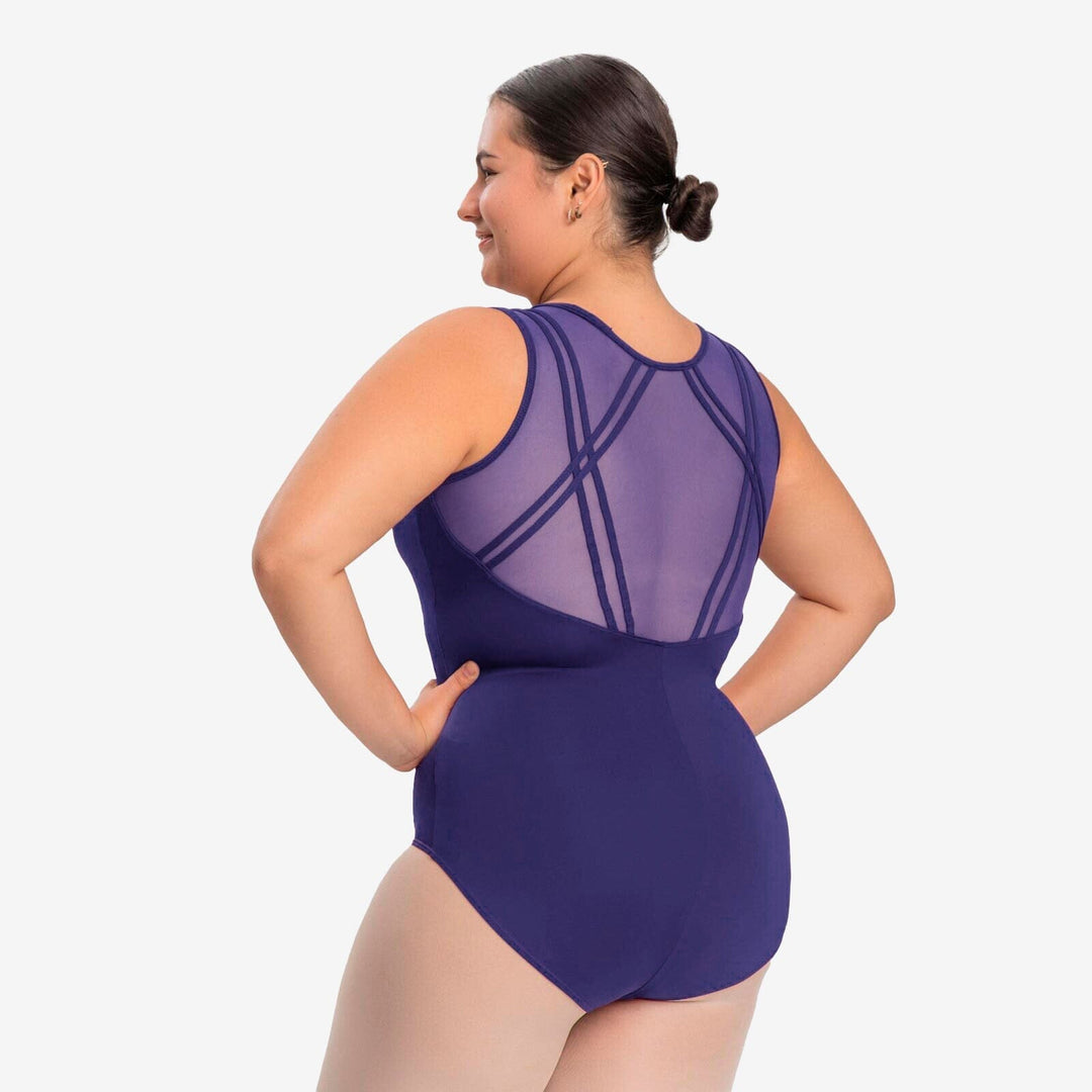 Woman wearing a purple swimsuit with geometric cutouts on a white background