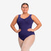 Woman wearing a purple swimsuit on a white background