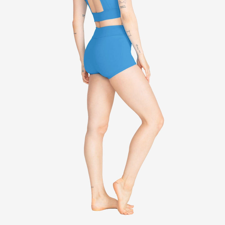 Person wearing a blue swimsuit on a white background