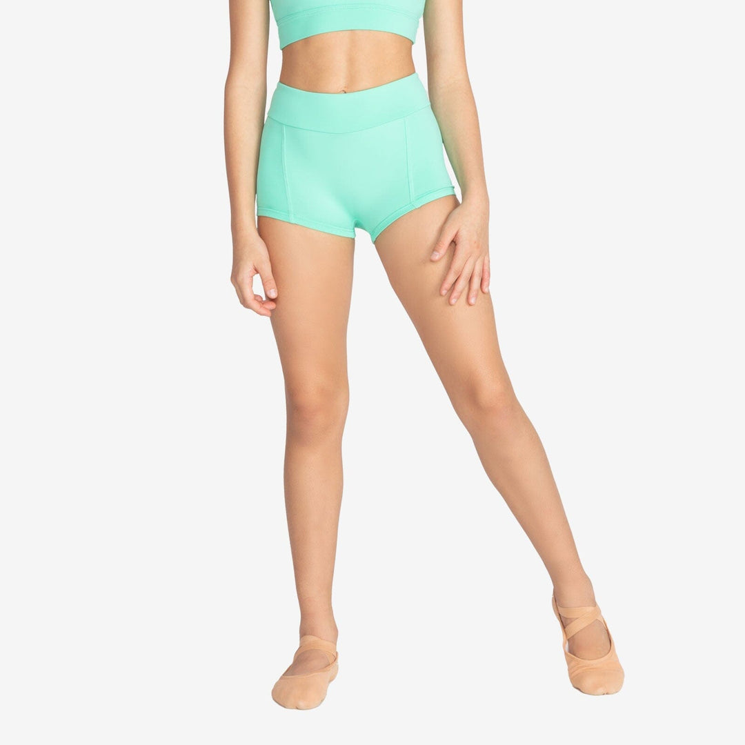 Person wearing mint green athletic shorts and a matching top on a white background