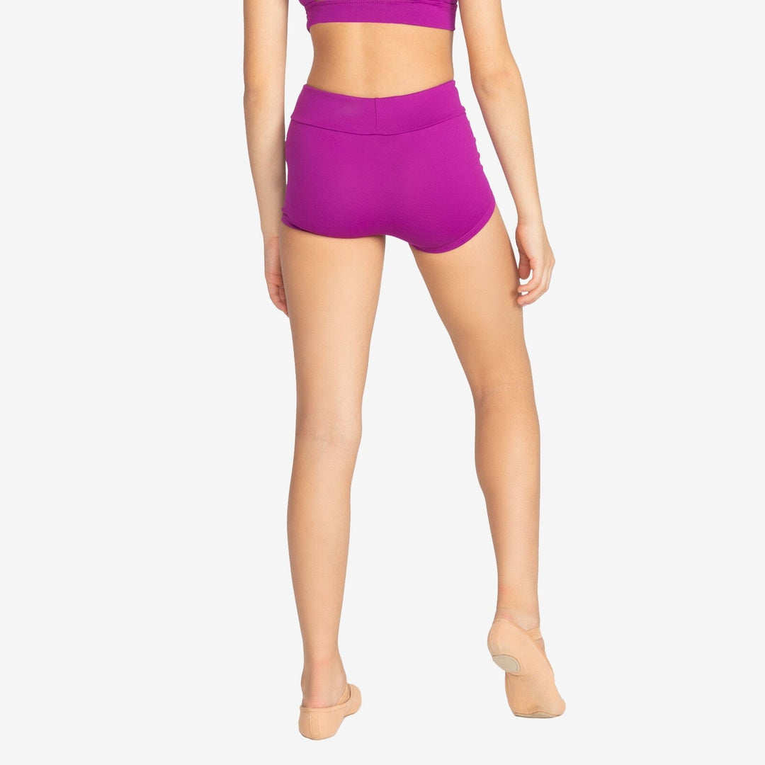 Person wearing a purple athletic outfit on a plain background