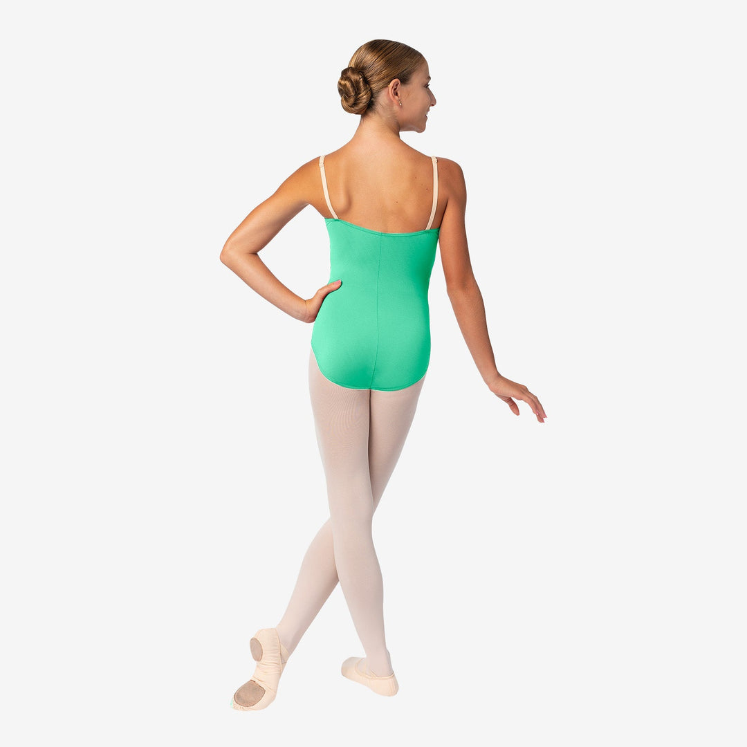 Ballerina in a green leotard and white tights on a white background