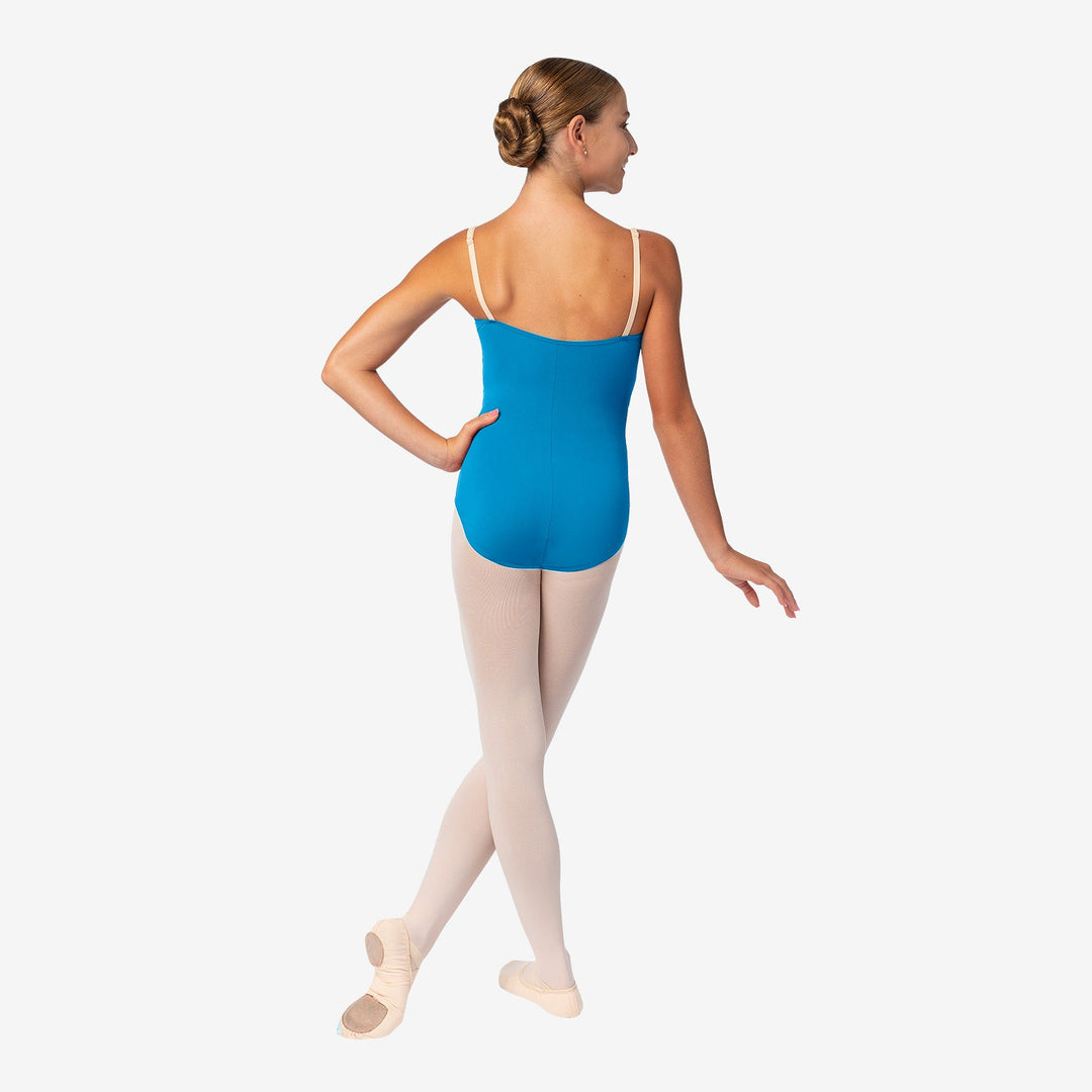 Ballerina in a blue leotard and white tights on a white background