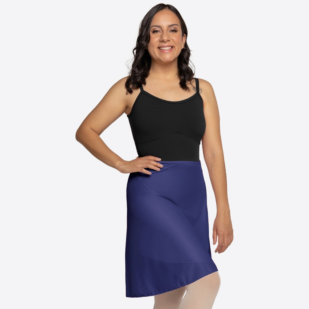 Woman wearing a black top and blue skirt on a white background