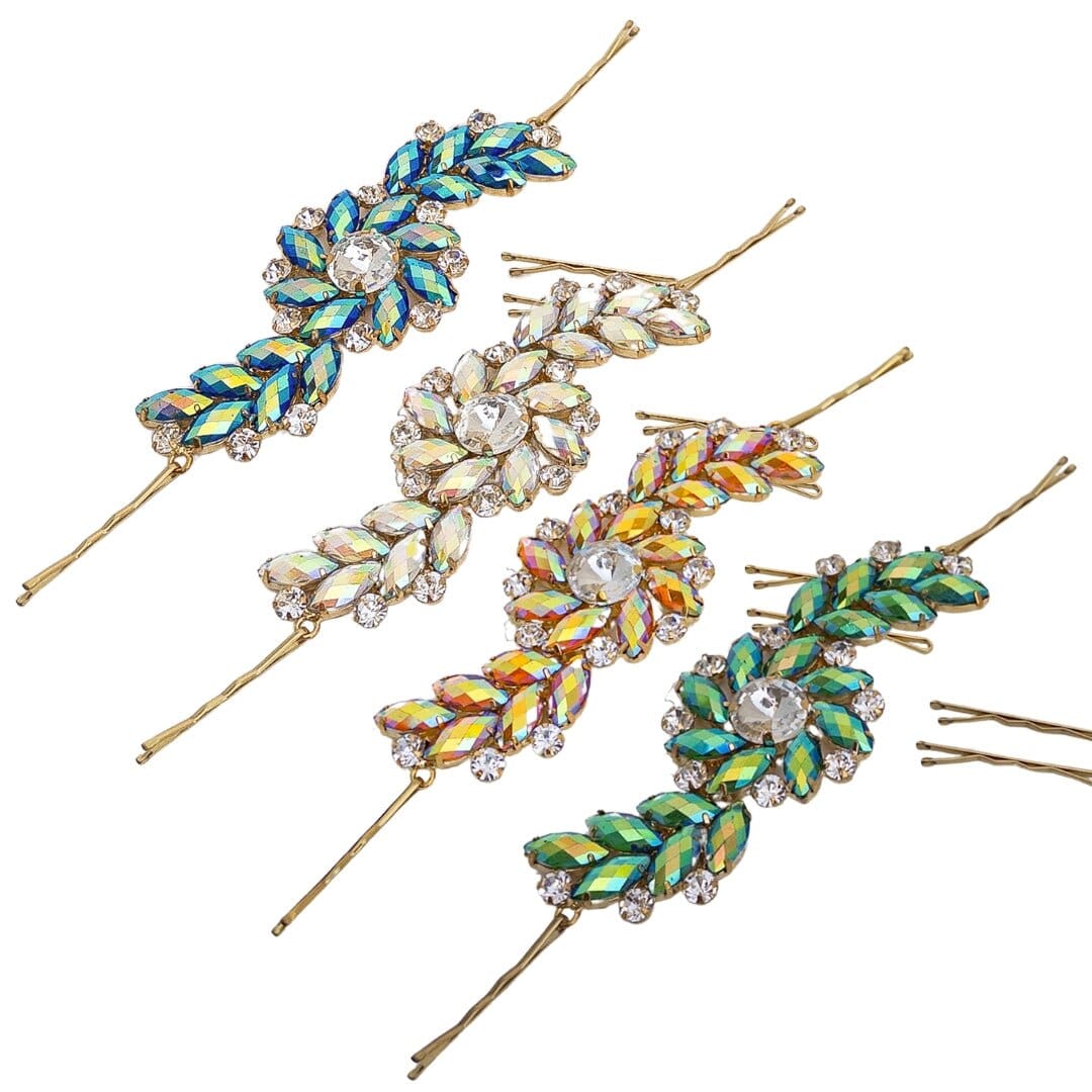 Set of decorative hair pins with gemstone-like embellishments on a white background