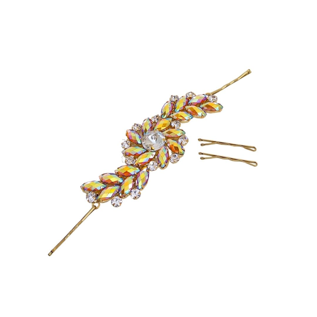 Decorative hairpin with colorful gemstones on a white background