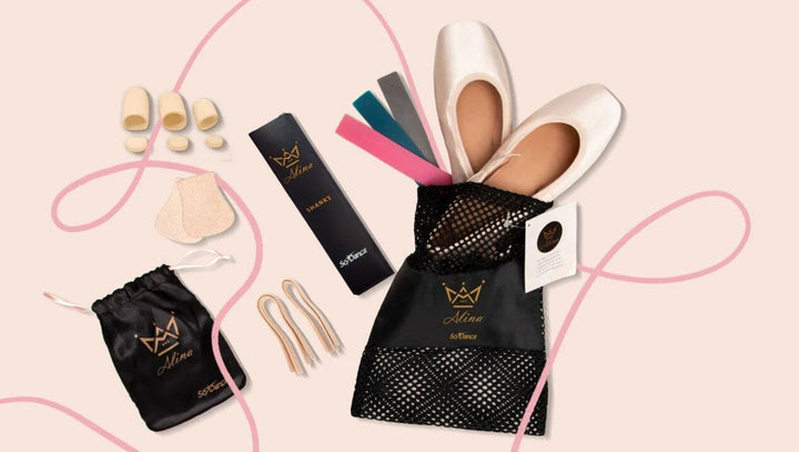 Ballet shoe care products including shoes, ribbons, and a black mesh bag on a pink background.