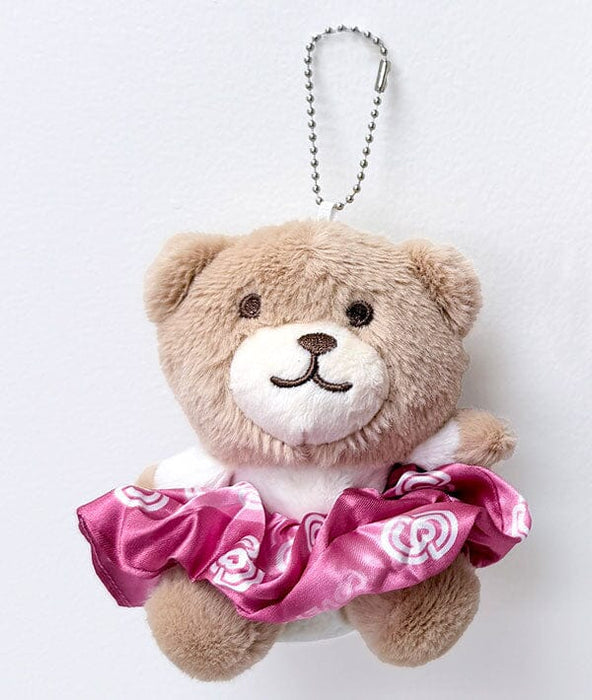 Plush teddy bear keychain with a pink skirt on a white background