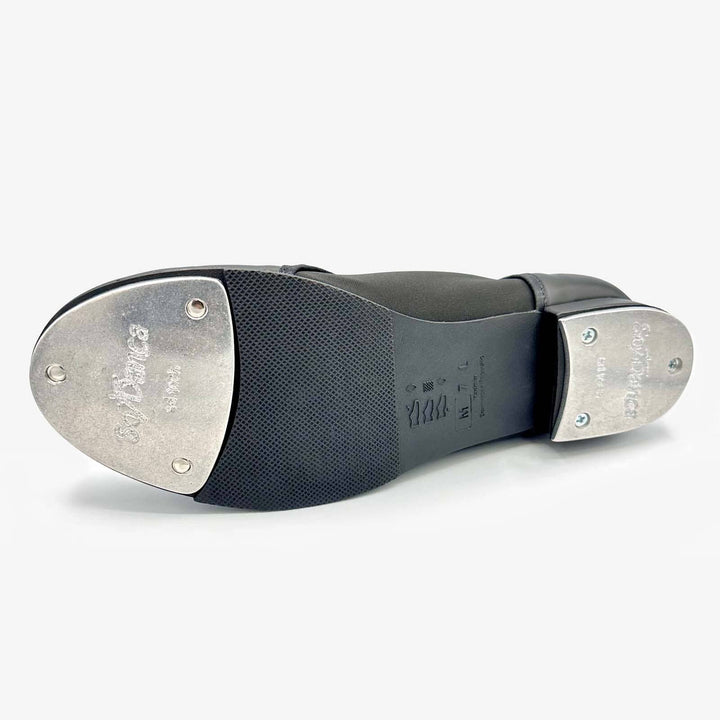 Close-up of tap shoe with metal taps on a white background