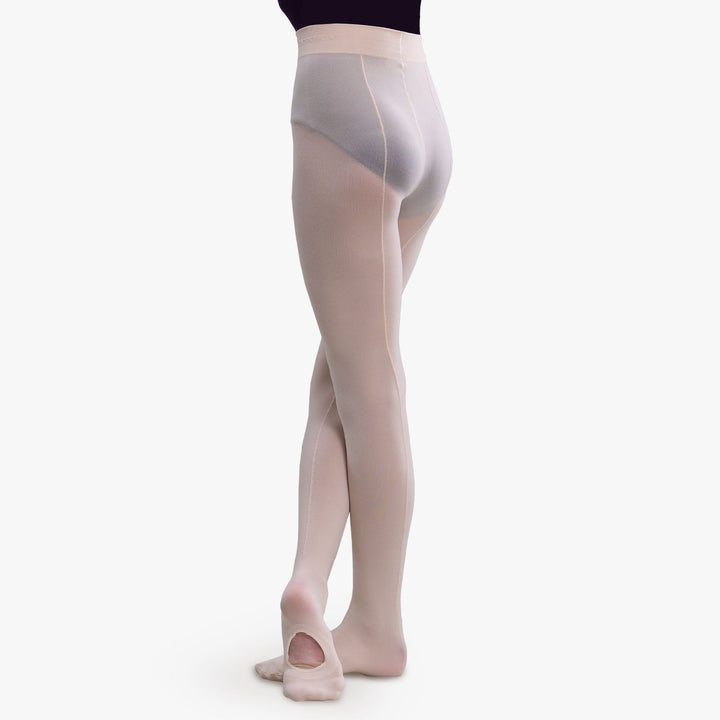 A model's lower body shown from the back wearing sheer, light pink tights and ballet slippers against a plain white studio background.
