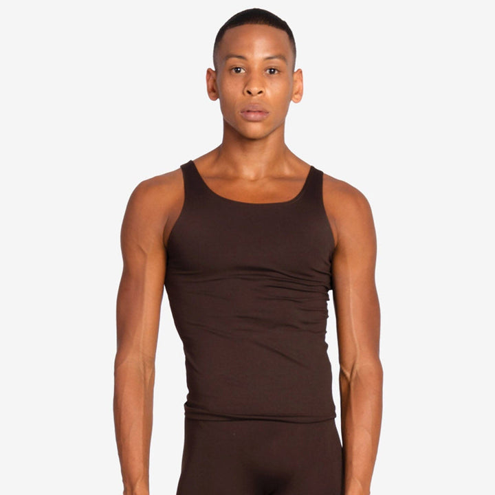 Man wearing a brown tank top against a plain background