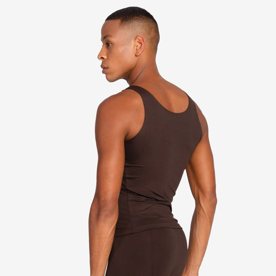 Person wearing a brown tank top on a white background