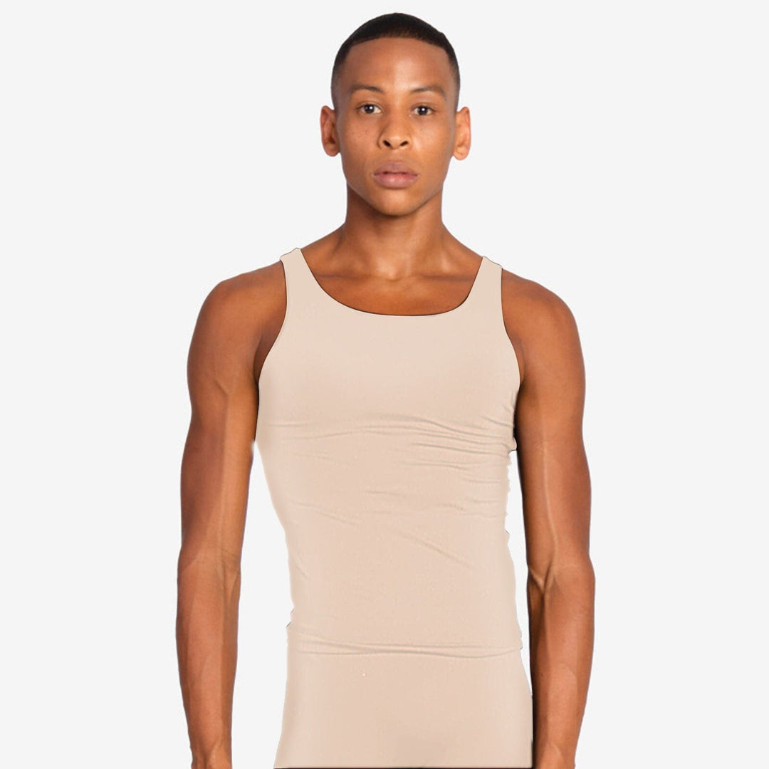 Man wearing a beige tank top against a plain background