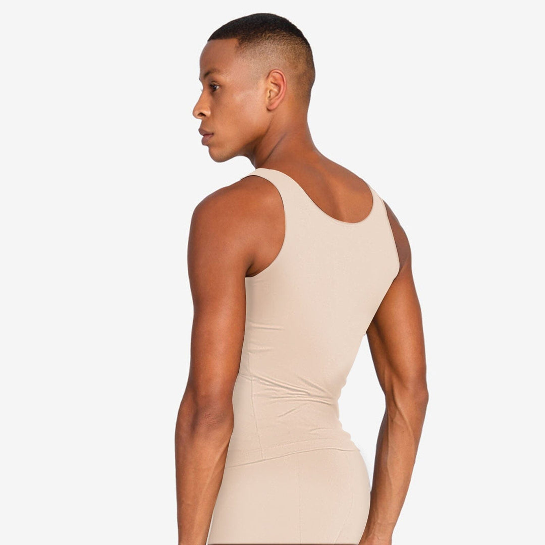 Person wearing a beige bodysuit against a white background