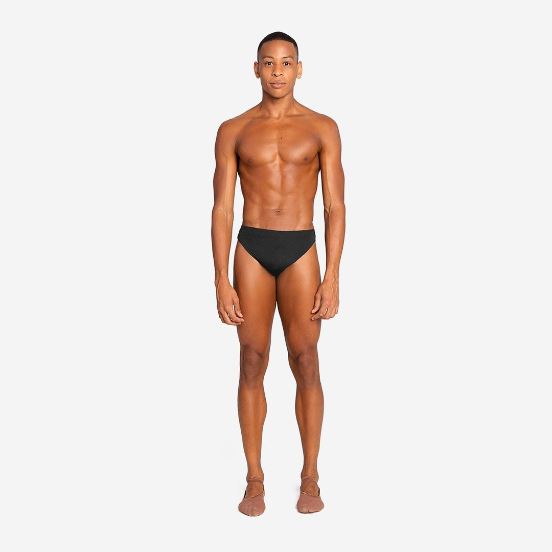 Man wearing a black swimsuit on a white background