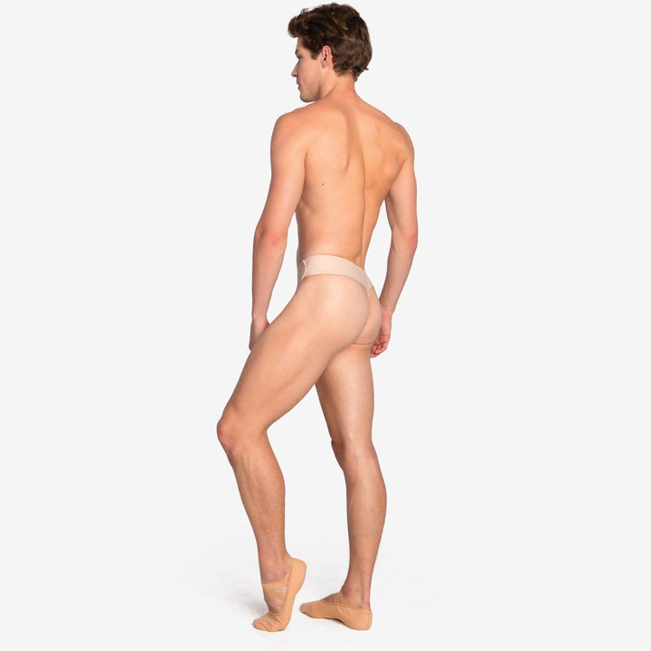 Man wearing beige men's underwear on a white background