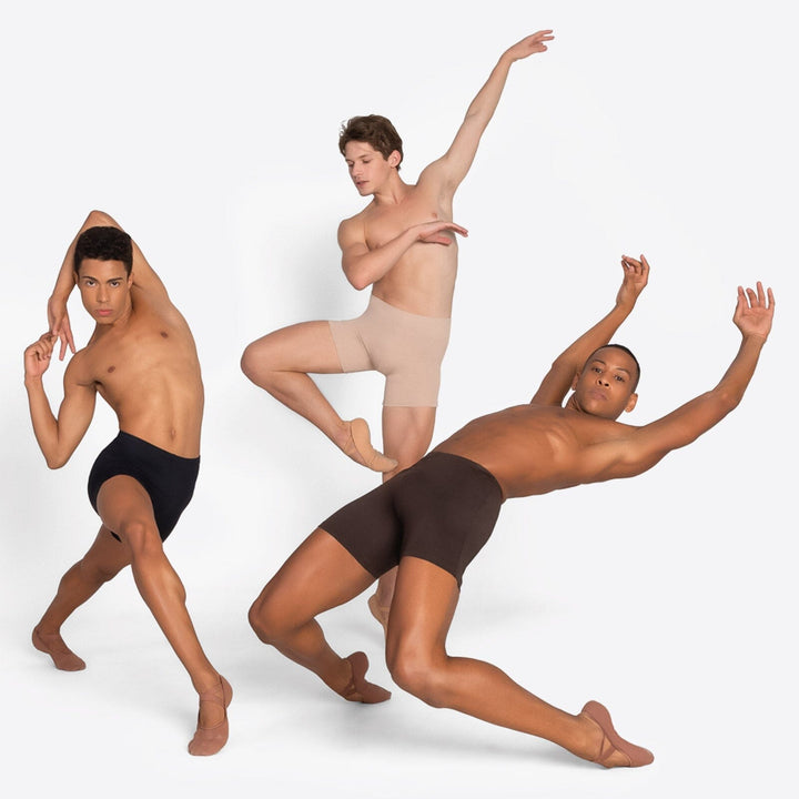 Three dancers in black, beige, and brown underwear posing against a white background