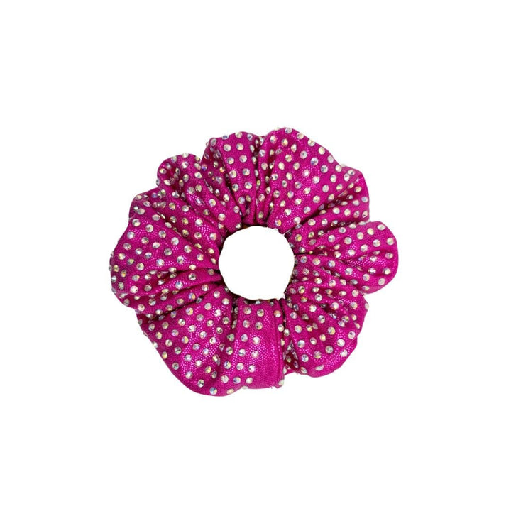Pink scrunchie with white polka dots on a white background