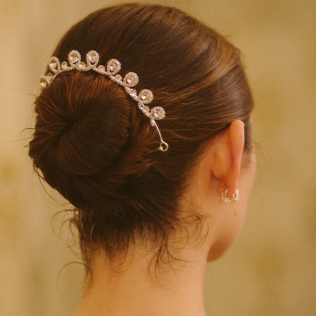 Woman wearing a decorative hair tiara with a blurred background