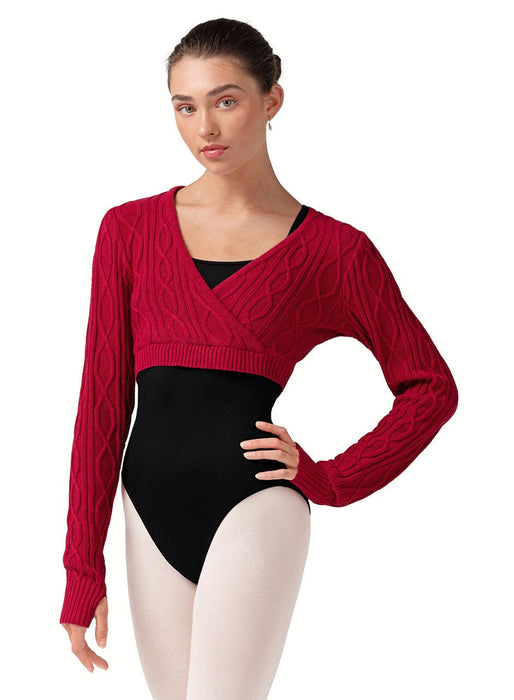 Woman wearing a red sweater over a black leotard on a white background