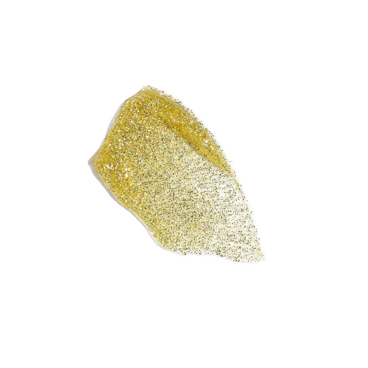 Gold glittery lip gloss swatch on a white background