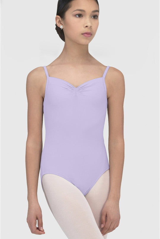 Young girl wearing a lilac leotard on a white background
