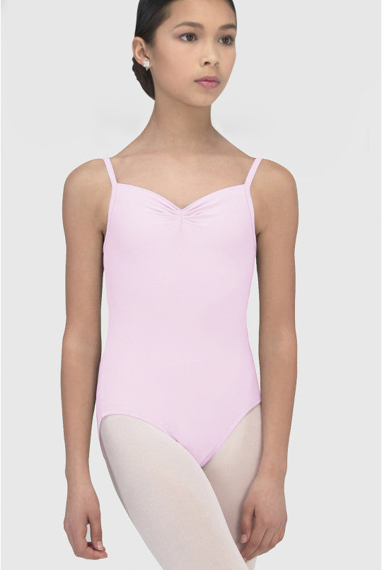 Person wearing a pink leotard on a white background
