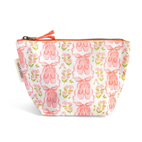 A white zippered cosmetic pouch featuring a repeating pattern of pink ballet shoes and small pink flowers with green leaves, shown on a white background.